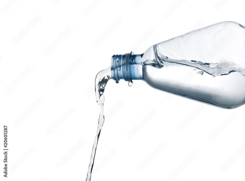 pouring mineral water from a bottle pouring mineral water from a bottle