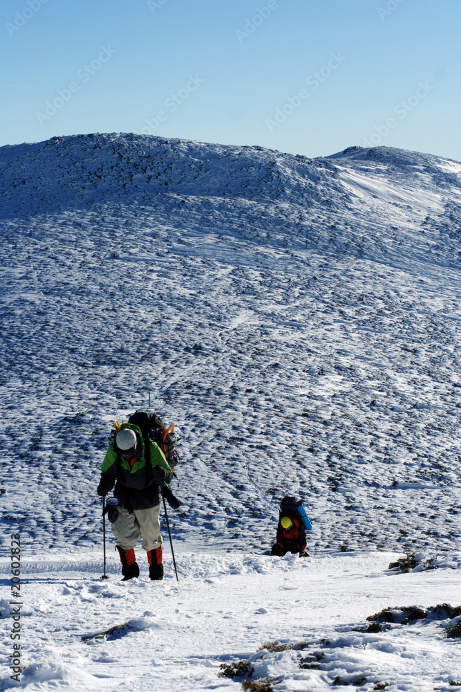 Hike in winter mountains