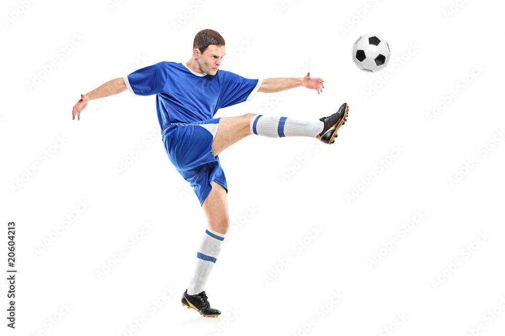 A soccer player shooting a ball