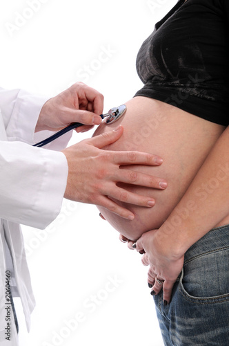 Pregnant Woman Being Checked by Doctor