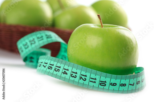 green apple and measuring tape