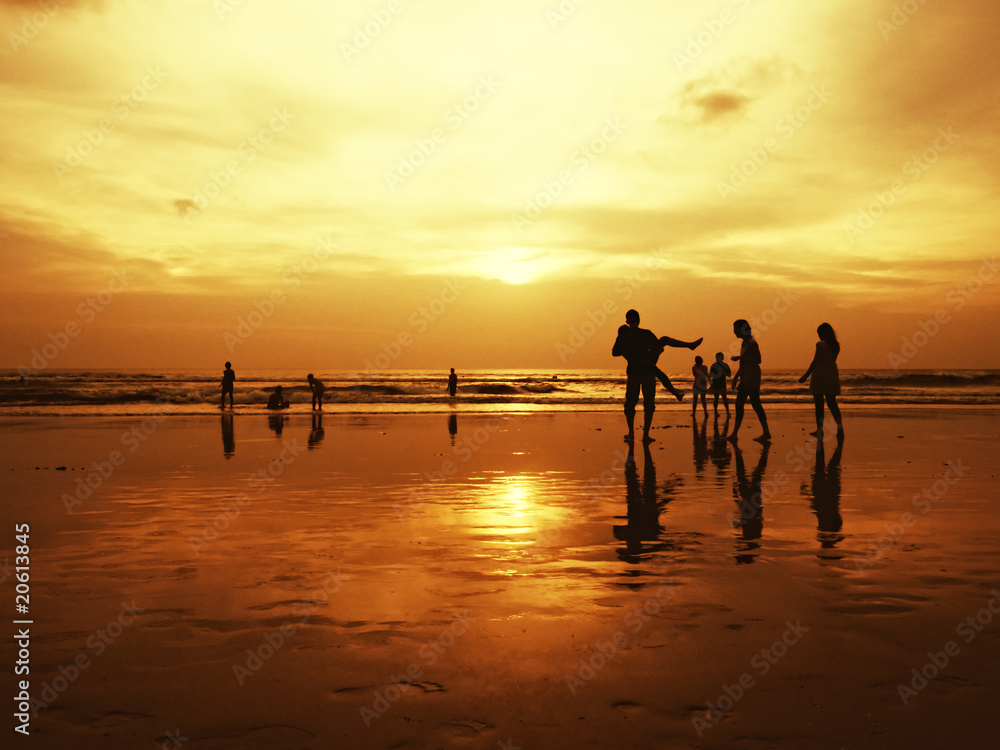 People at sunset on the beach.Kuta,Bali,Indonesia.