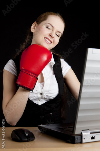 businesswoman with a notebook and boxing glove