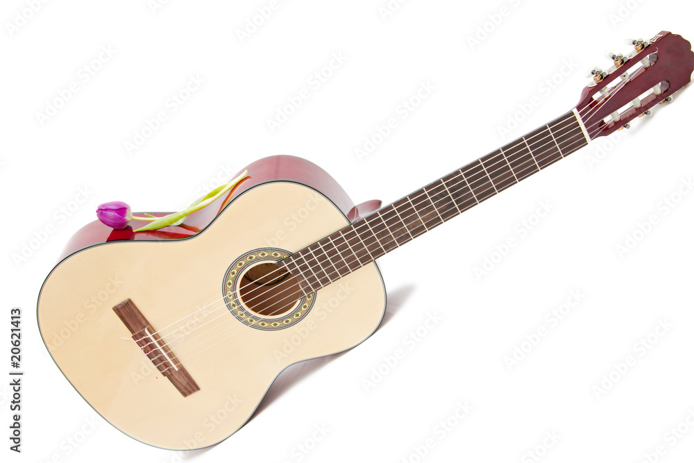 Obraz premium a yellow acoustic guitar isolated on white