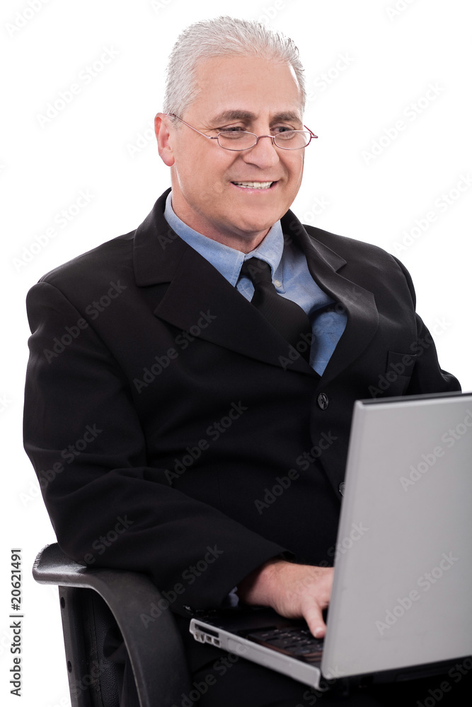 Mature business man in working with laptop Mature business man in working with laptop
