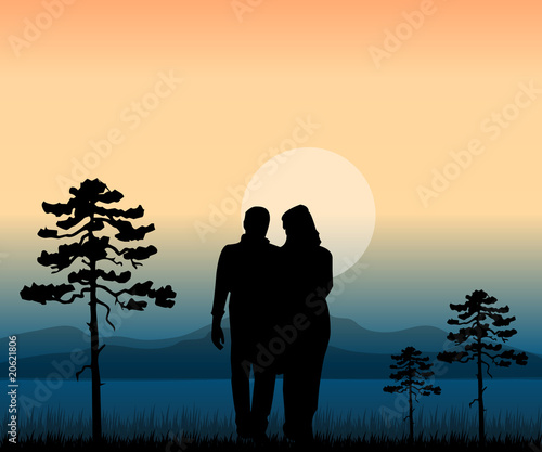 couple walking in the nature at sunset