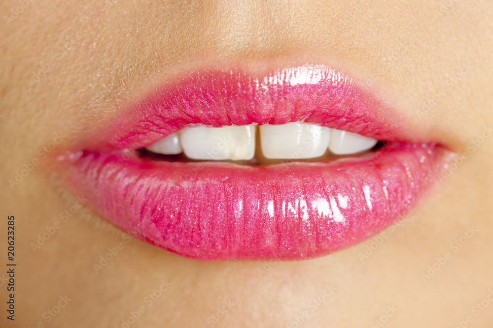 Obraz premium pink lipstick on lips