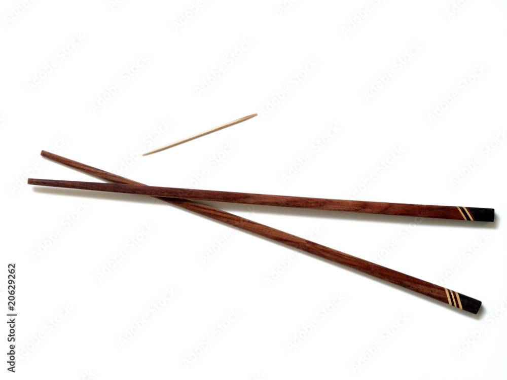 Two brown chopscticks with toothpick