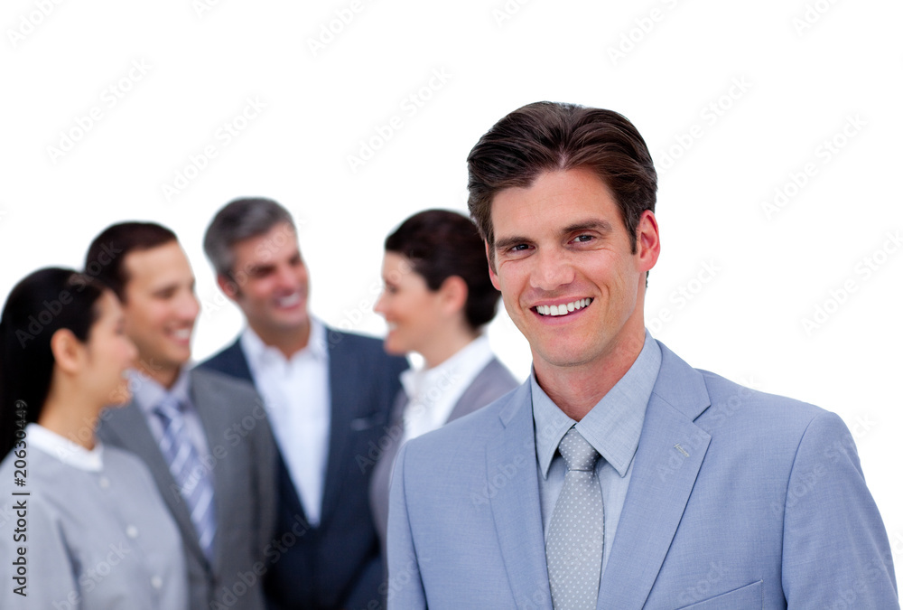 Charismatic businessman standing in front of his team Charismatic businessman standing in front of his team