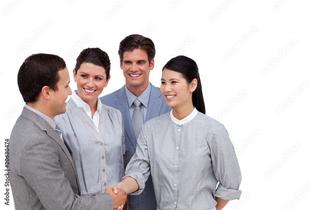 Multi-ethnic business partners shaking hands Multi-ethnic business partners shaking hands