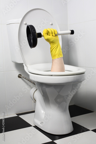 Fotografie unusual plumber with plunger (joke)