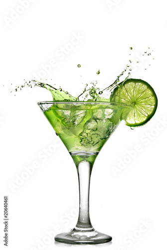 Green alcohol cocktail with splash and green lime isolated #20640461