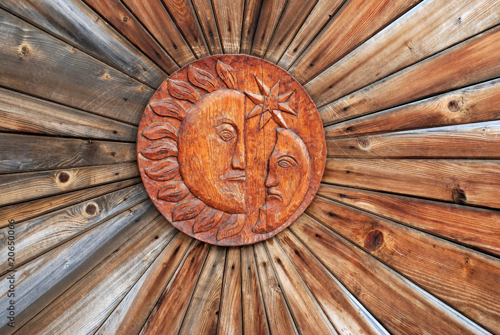 Sun and Moon in wood sculpture