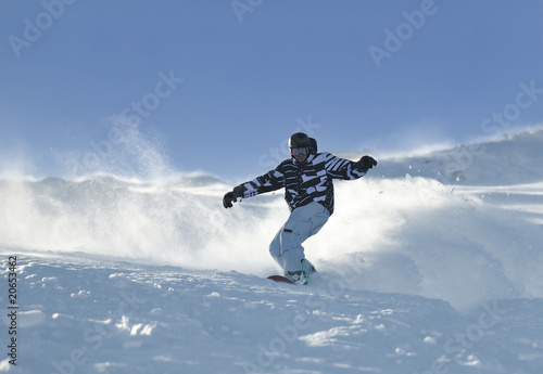 freestyle snowboarder jump and ride