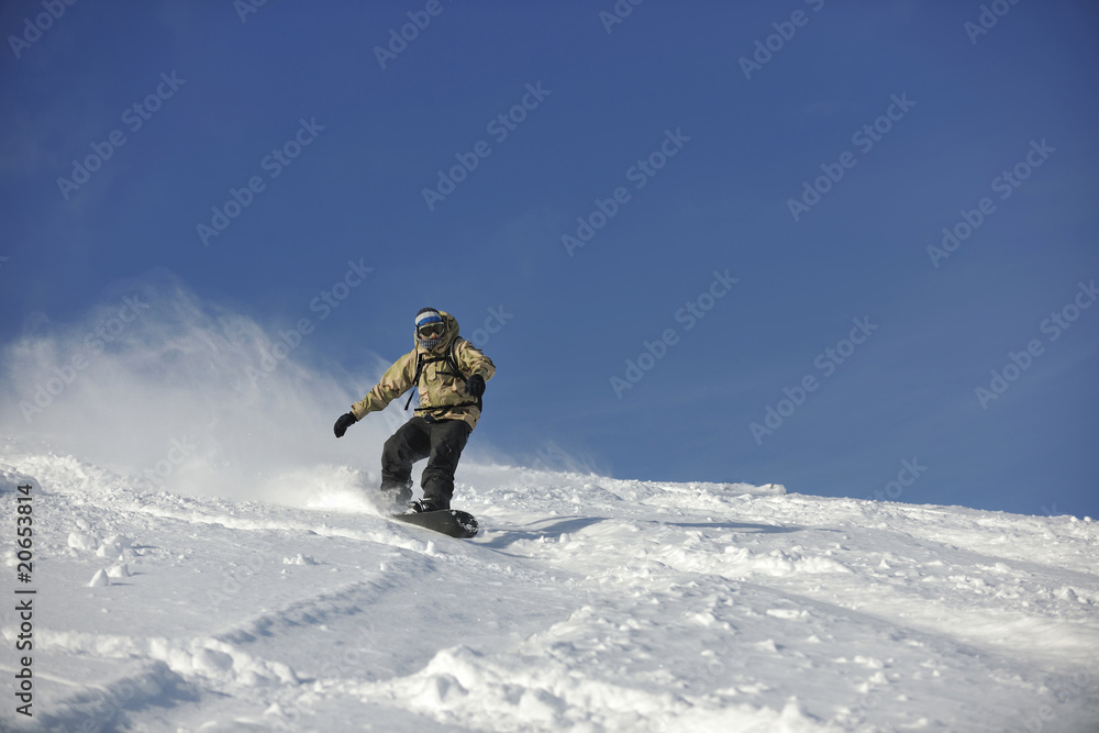 freestyle snowboarder jump and ride