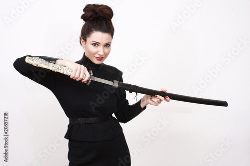 Beautiful woman wielding a samurai sword.