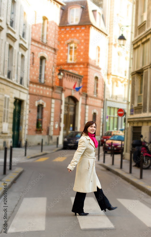 Beautiful woman in Paris, crossing a street