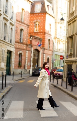 Beautiful woman in Paris, crossing a street © Ekaterina Pokrovsky