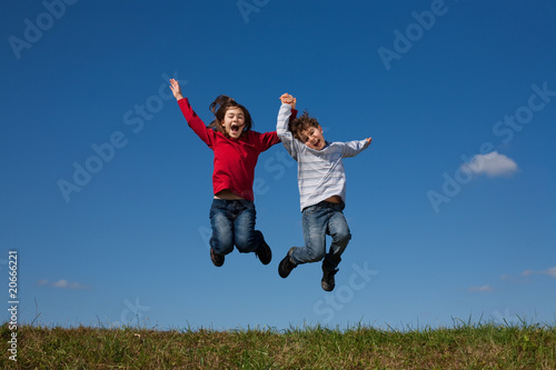 Girl and boy jumping  running outdoor