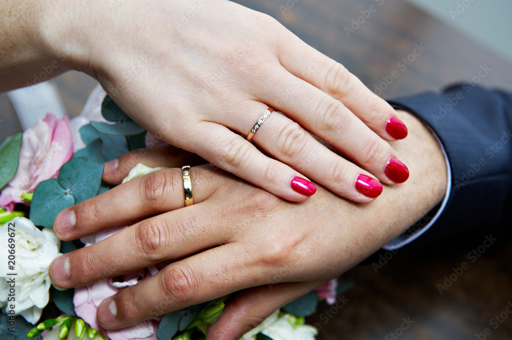 Hands with wedding rings newlyweds Hands with wedding rings newlyweds