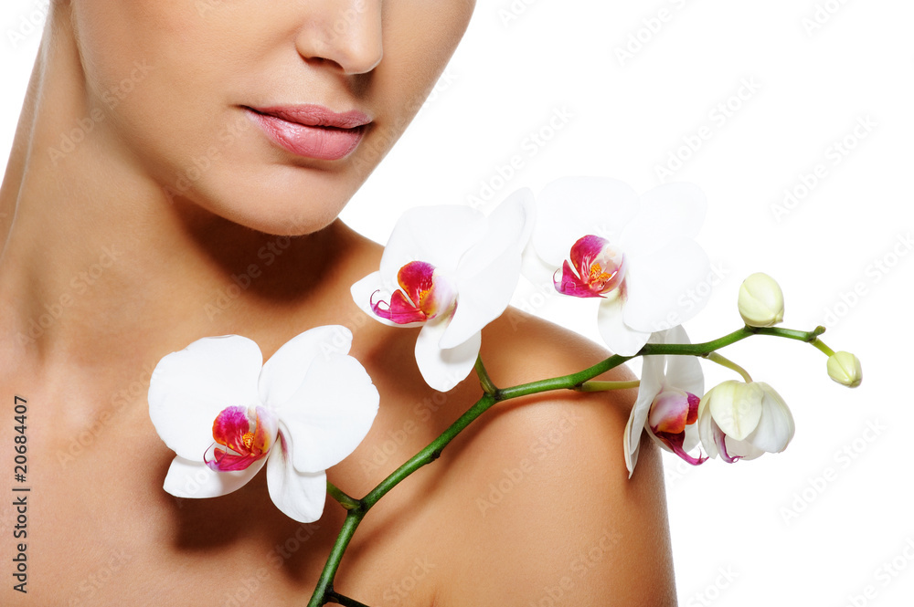 Beauty flower lying on nude female shoulder Beauty flower lying on nude female shoulder