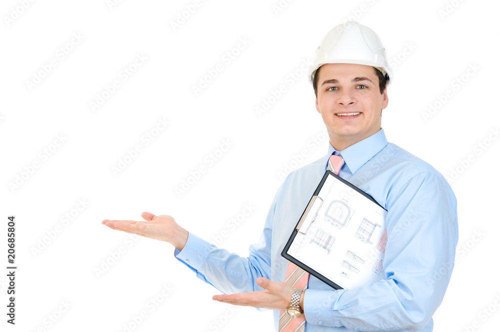 An engineer with white hard hat holding clipboard An engineer with white hard hat holding clipboard
