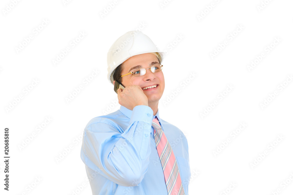 An engineer talking on his mobile phone on white An engineer talking on his mobile phone on white