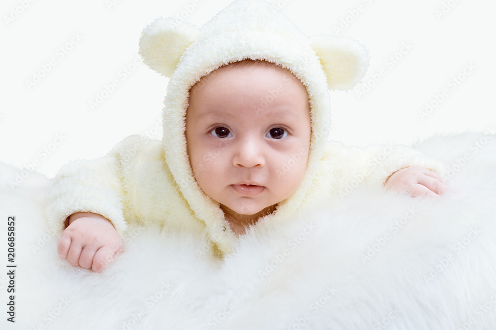 The newborn is dressed in a suit of a bear cub The newborn is dressed in a suit of a bear cub