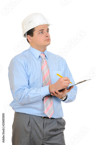 An engineer holding clipboard and hard hat on white