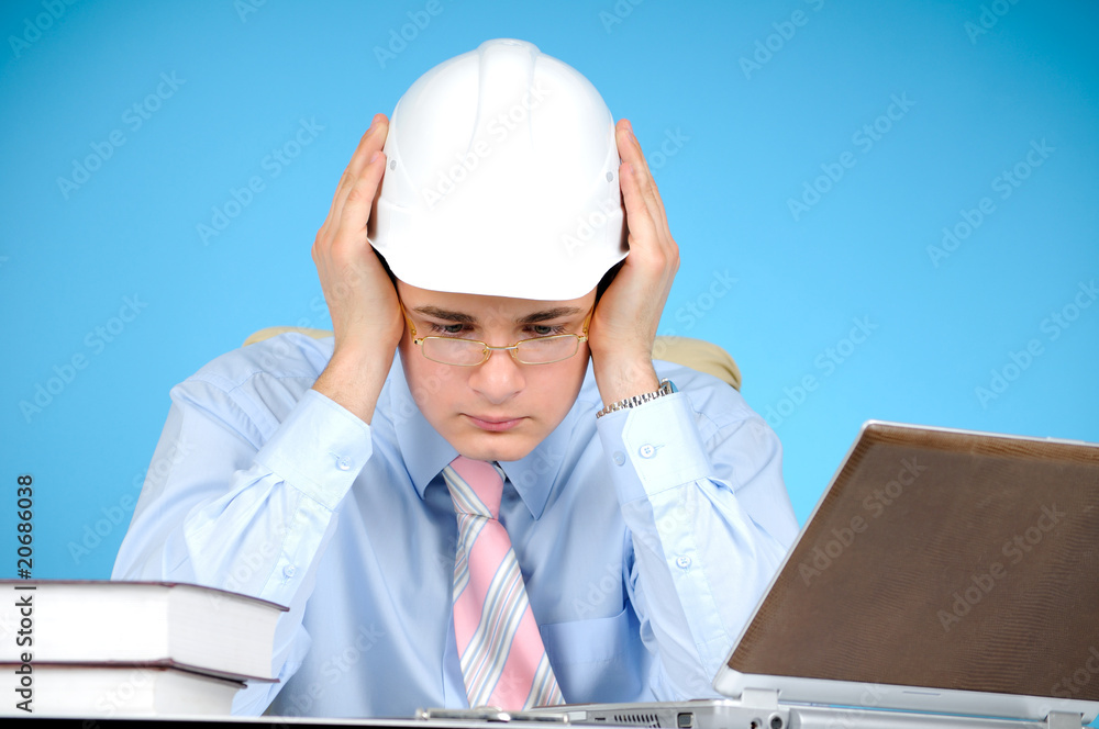 An engineer with white hard hat at work An engineer with white hard hat at work