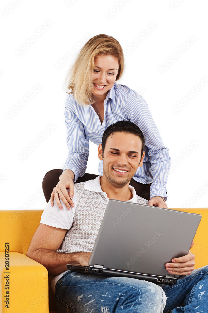 Happy couple with laptop computer