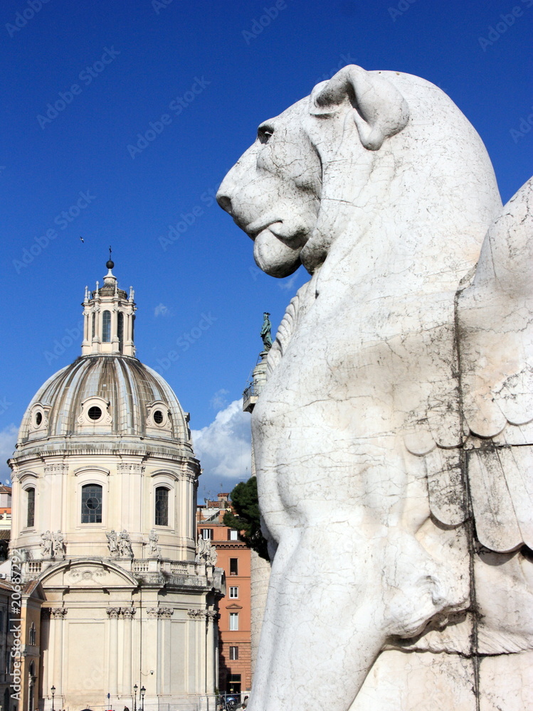 Rome: giant lion statue and a chapel in the historic center Rome: giant lion statue and a chapel in the historic center
