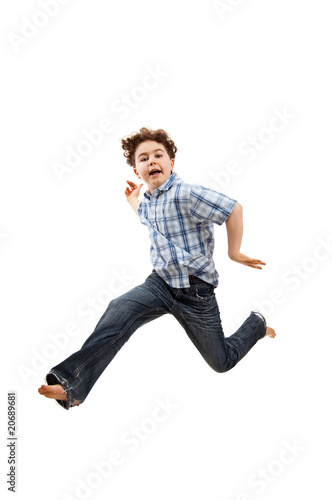 Boy jumping isolated on white background © Jacek Chabraszewski
