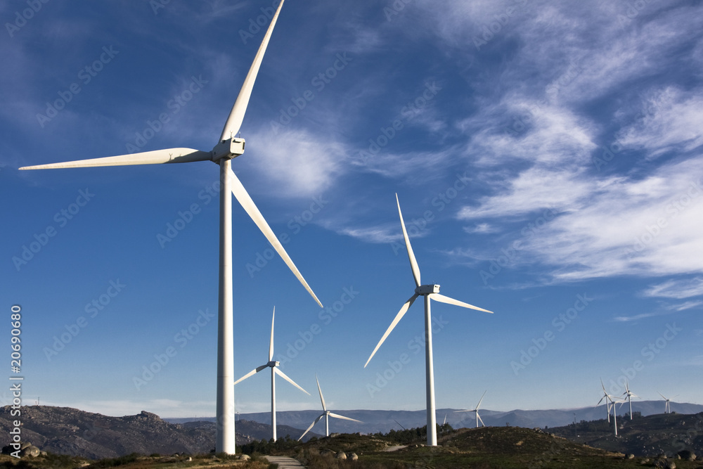 white wind turbines in the top of the mountain white wind turbines in the top of the mountain
