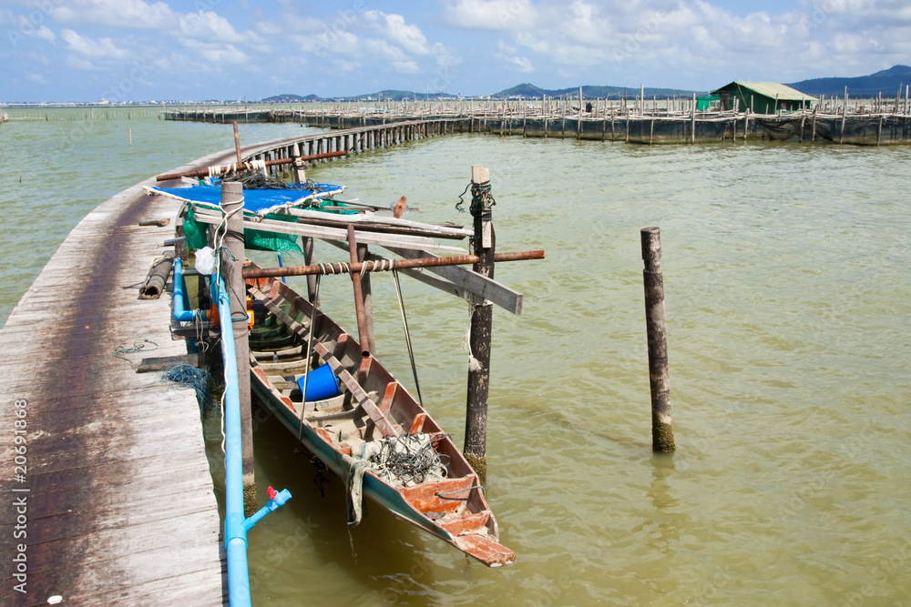 Bridge to fisherman house in Thai sea