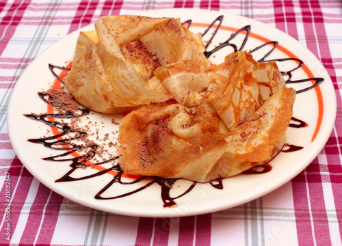 pancake with chocolate on a plate photo