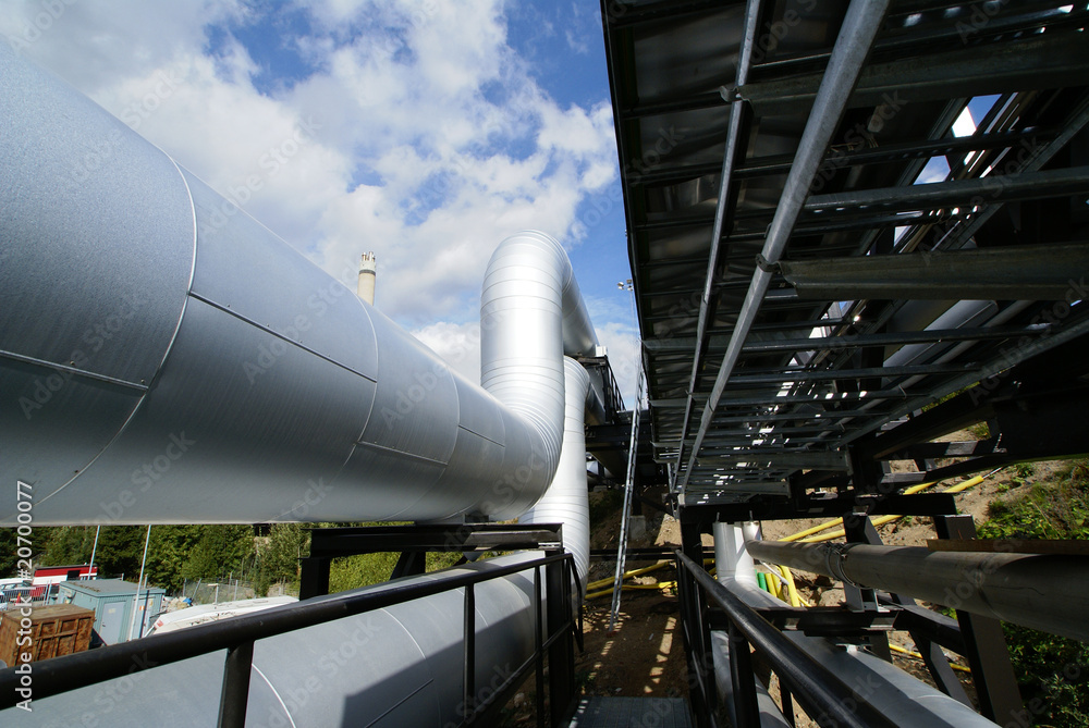 industrial pipelines on pipe-bridge against blue sky industrial pipelines on pipe-bridge against blue sky