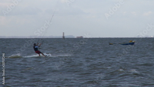Kitesurfer in action jumping