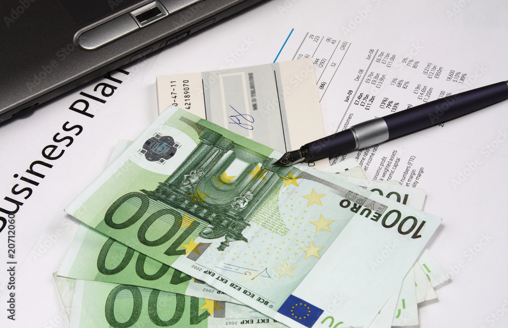 Business Plan with Euro notes, check book and a pen Business Plan with Euro notes, check book and a pen