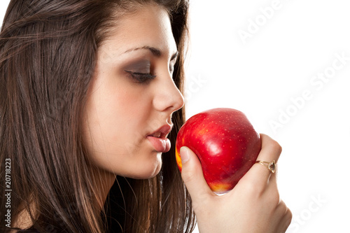 Beautiful brunette with apple