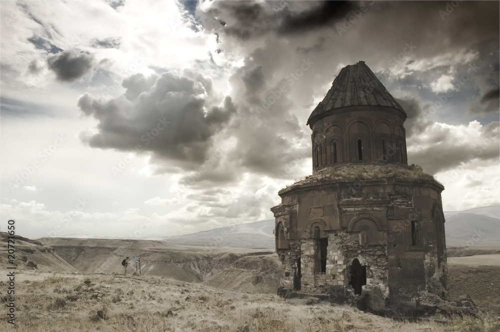ruined church in a dry dark landscape