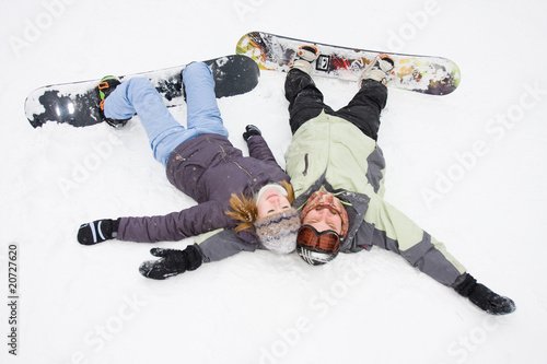 pair of snowboard lying near the snow