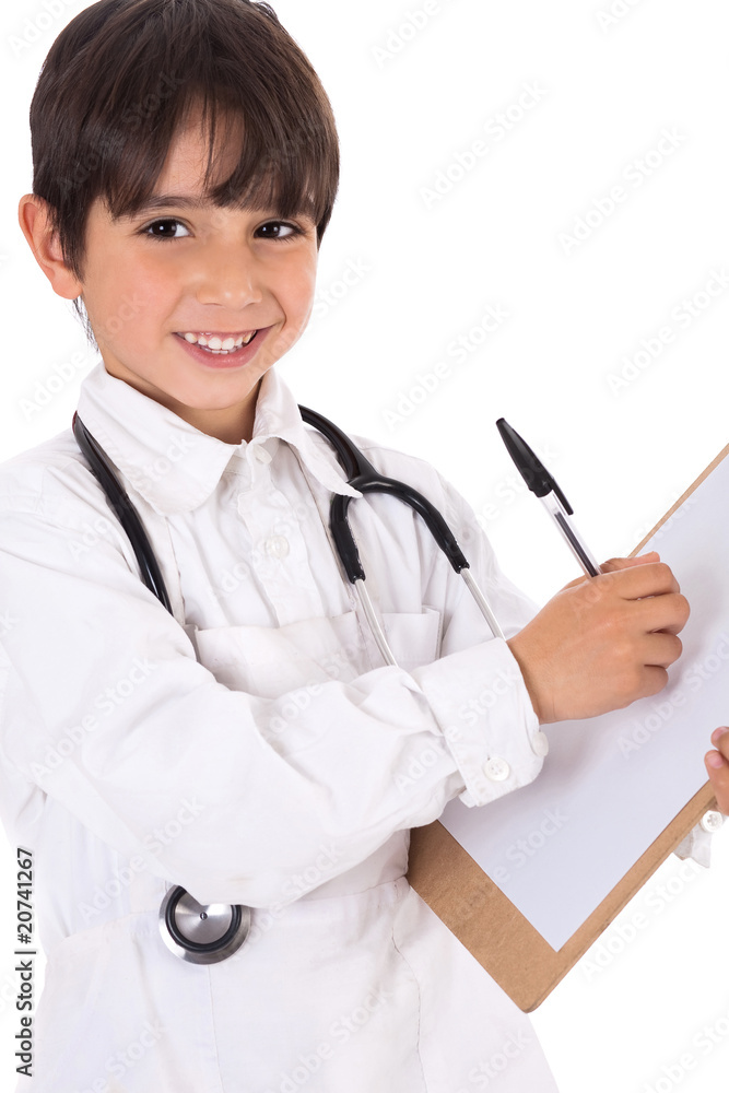 Little boy doctor writes on his clipboard for diagnosis Little boy doctor writes on his clipboard for diagnosis