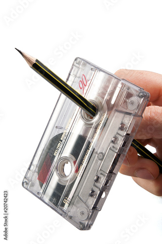 Rewind of vintage cassette with pencil