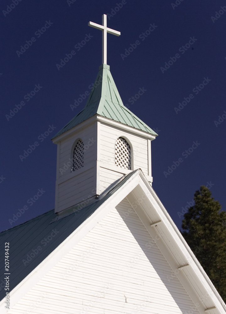The top view of a cross on a church steeple.