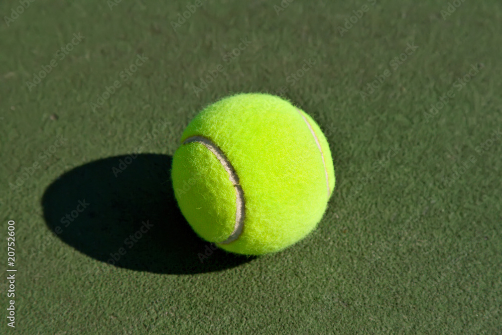 Yellow Tennis Ball on Hard Court