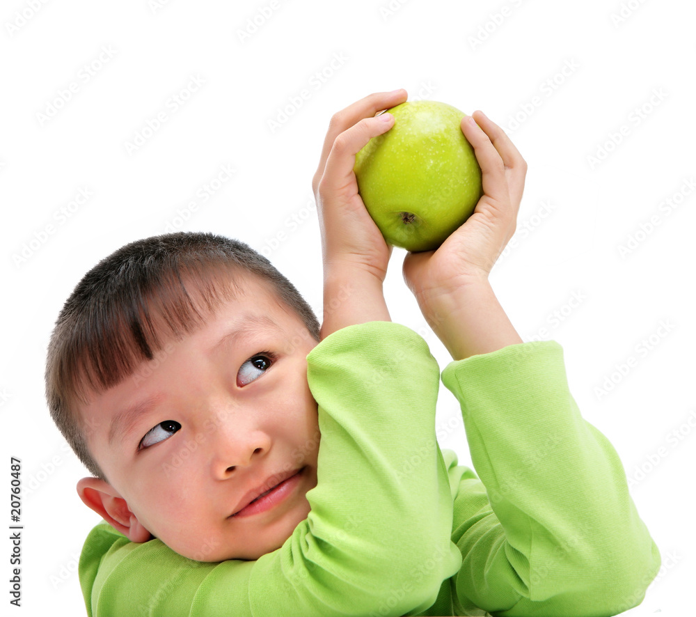 asian boy holding a big green apple asian boy holding a big green apple