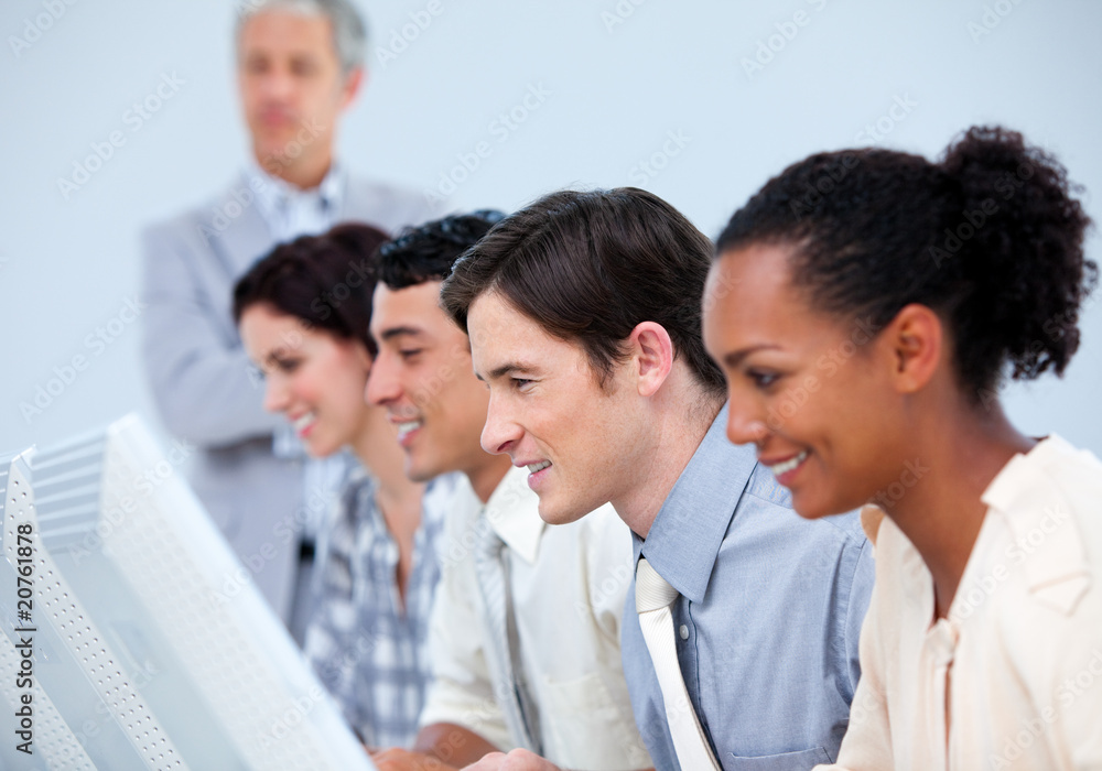 Concentrated business people with their senior manager Concentrated business people with their senior manager