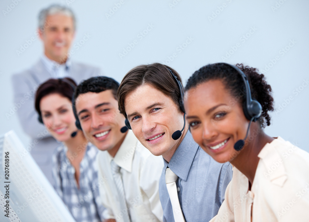 Positive business people working in a call center Positive business people working in a call center