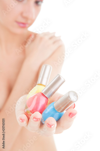 Elegant woman choose the color of nail polish